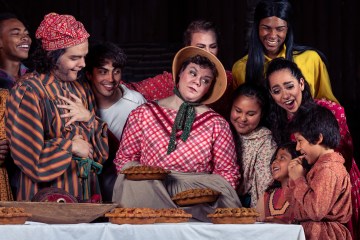 a group of people sitting posing for the camera